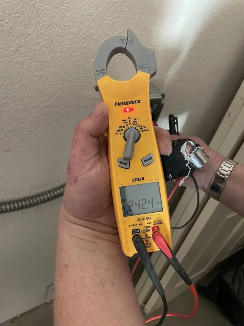 Voltage testing with clamp meter during Electrical Installation Services in Crawford